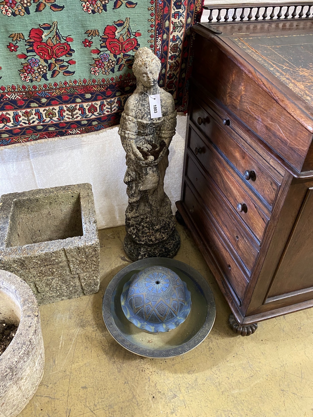A reconstituted stone figural garden ornament, height 80cm together with a pottery bird bath